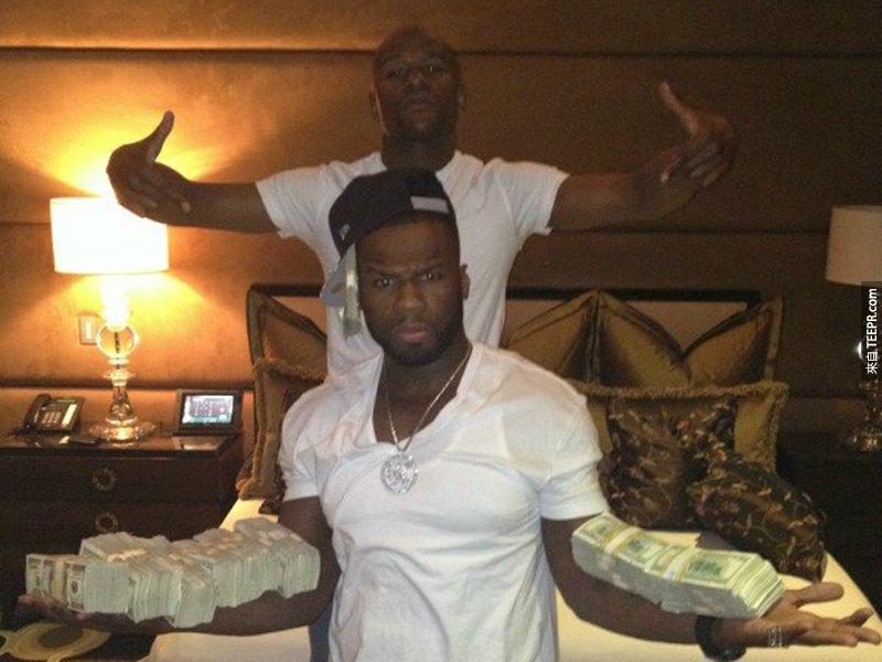 4. He hung out with 50 Cent, who balanced what looks like $400,000 on his forearms.