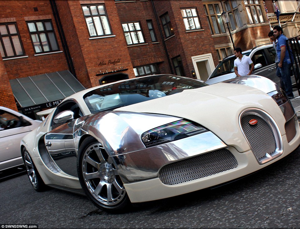A Bugatti Veyron Centenaire - one of the most expensive cars to be made in the world -d rives past admiring onlookers outside The Levin where Miss Radionova's car was spotted 