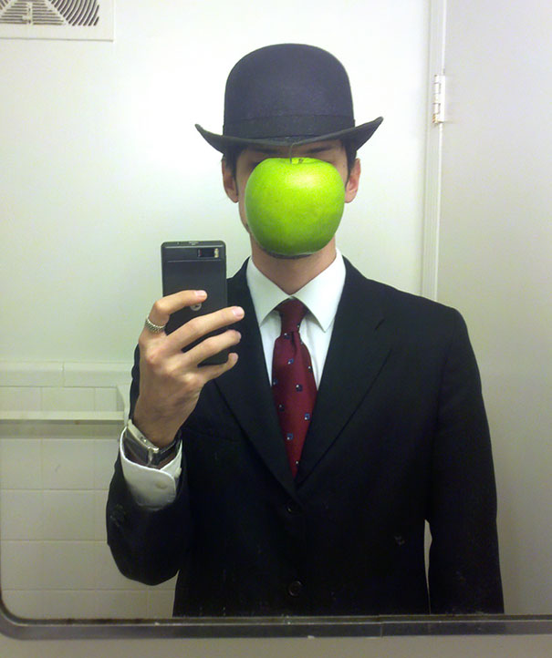 17. 超现实画家 雷内·马格利特(René Magritte)《戴黑帽的男人》(The Son of Man)