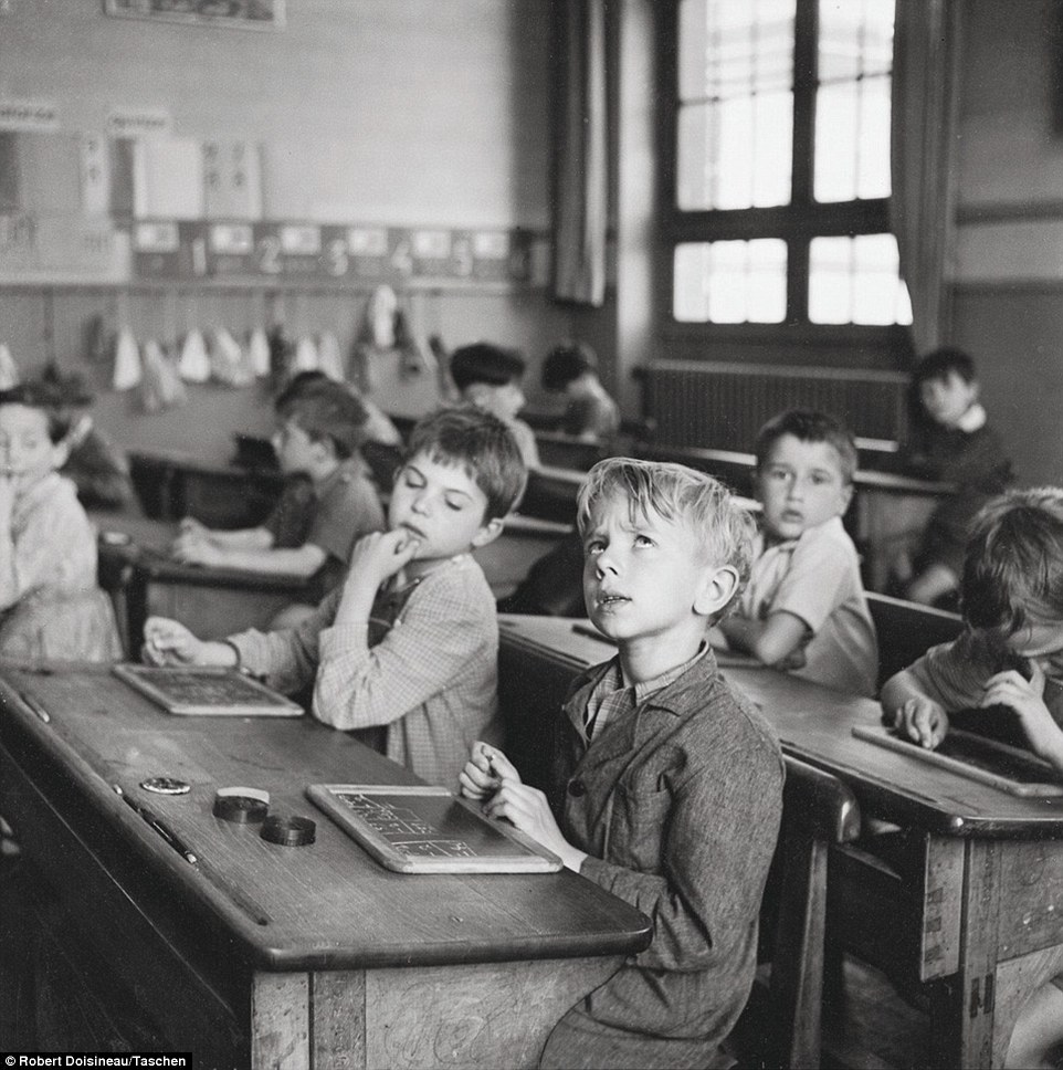 Tough lesson: Doisneau caught this young child looking pained as he attempts to work out his sums in a class