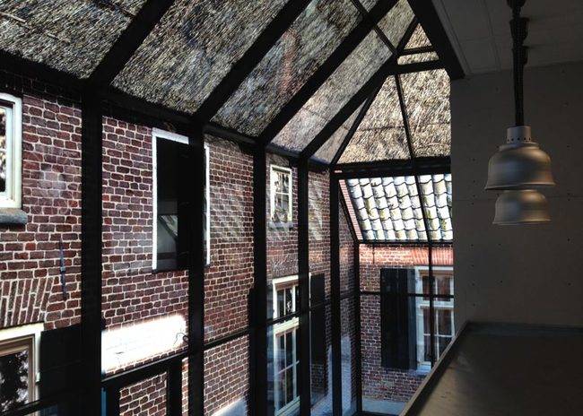 <p>The pattern of bricks and windows is simply printed on the glass, making a bright airy workspace inside without sacrificing the historical charm of the area. </p>