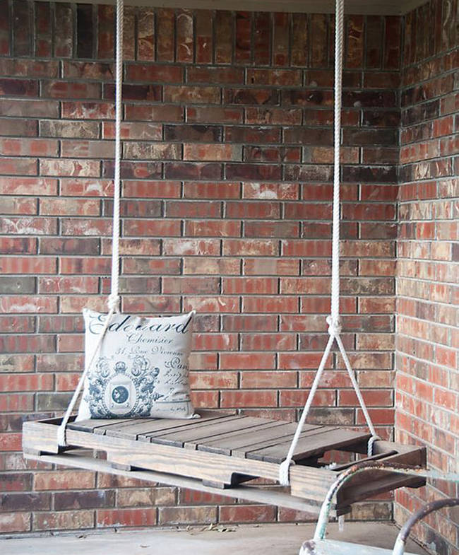 11.) Relax on your patio with this pallet porch swing.