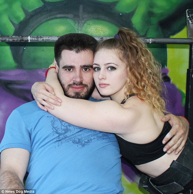 Pictured with boyfriend Sergei, 29, also from Russia, who likes to weight lift with her