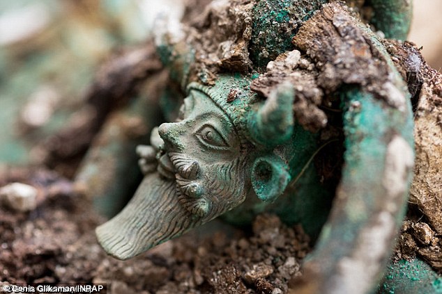 The biggest find at the site was a huge wine cauldron. Standing on the handles of the cauldron, is the Greek god Acheloos. The river deity is shown with horns, a beard, the ears of a bull and a triple mustache