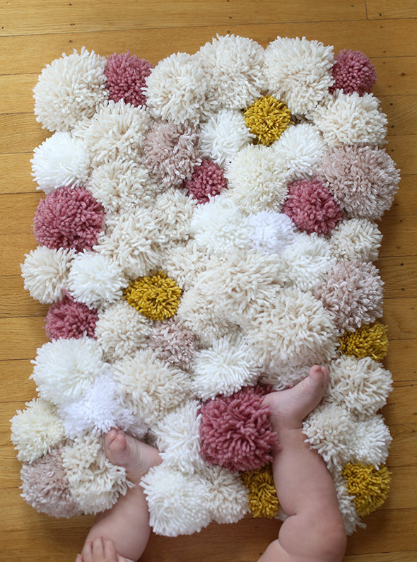 Make cold tile floors 110% cozier with a pom-pom rug DIY.