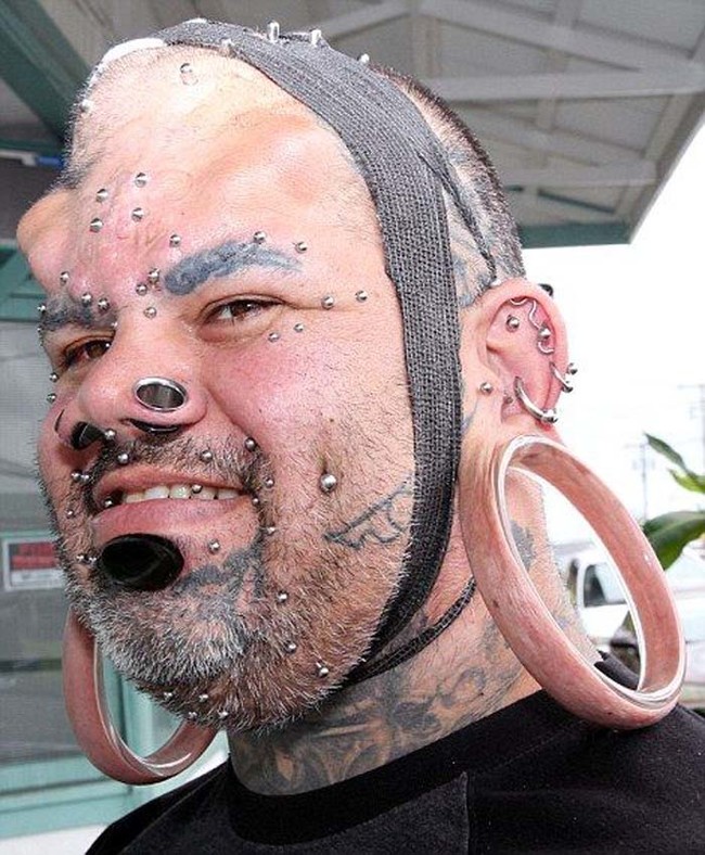 This man holds the world record for largest ear gauges.