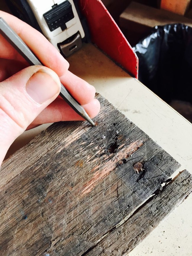 Take two pieces of old wood (in this case, old apple bin boards). Remove the nails and put them through a planer.