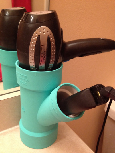 Keep curling irons stowed neatly in mounted PVC pipe.