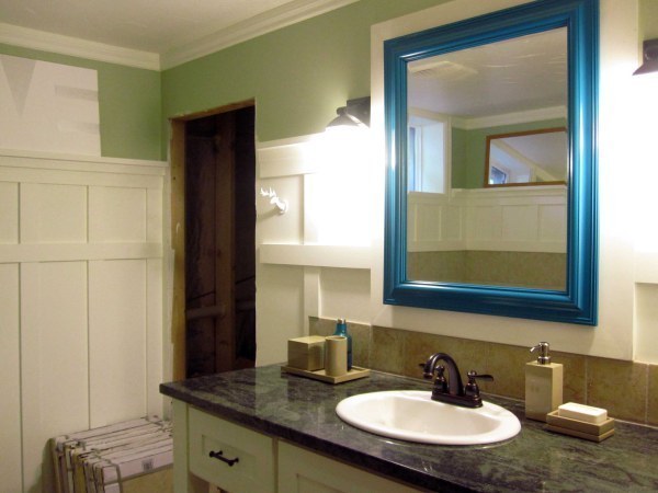 Give a standard bathroom mirror a makeover with a brightly colored frame.