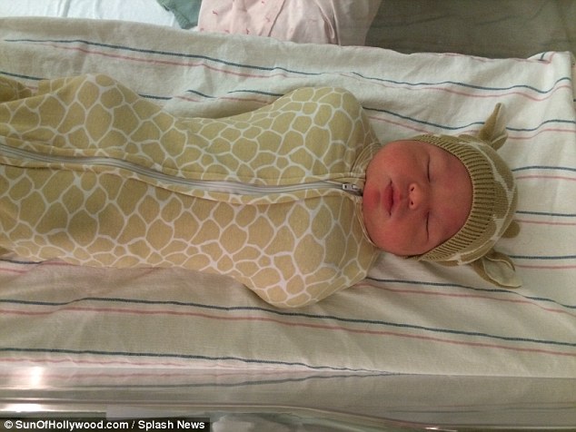 Nap time: In this gorgeous snap, James is seen sleeping in a giraffe costume 