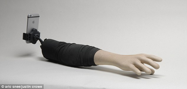 The 'selfie arm' is made of fiberglass, is lightweight and portable, 'and fortunately only a prototype,' the pair say.