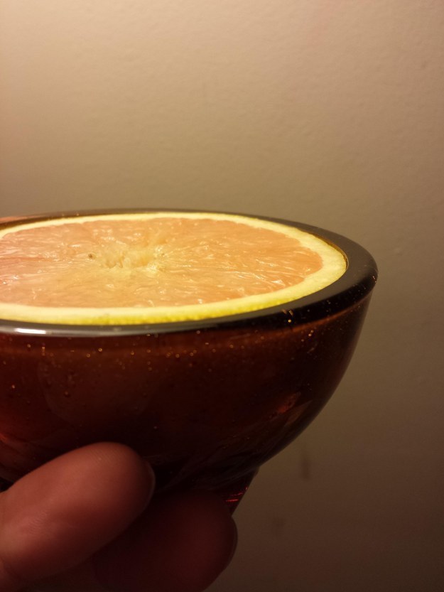 This topless grapefruit in a skintight bowl: