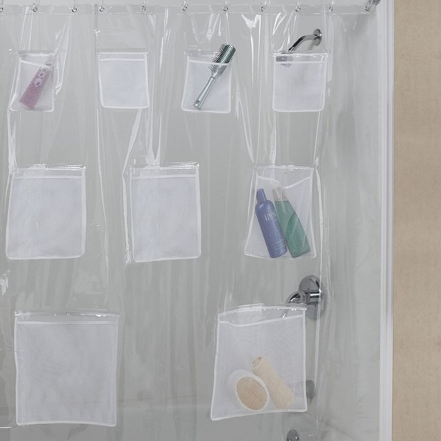 This shower curtain liner with mesh pockets.