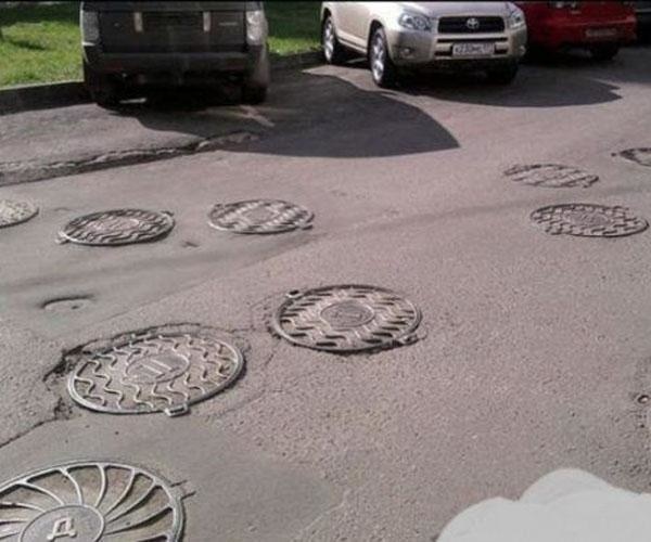You say "giant gaping hole in the road," I say "an opportunity to increase the sewer population."