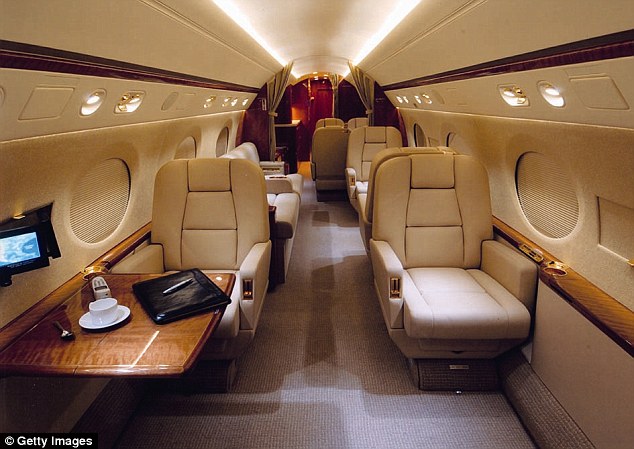 Globetrotter: As the chairman of Dalian Wanda Group - which has total assets worth around £85billion - he lives a life of unbridled luxury and travels the world in jets worth up to £32million each (file photo)