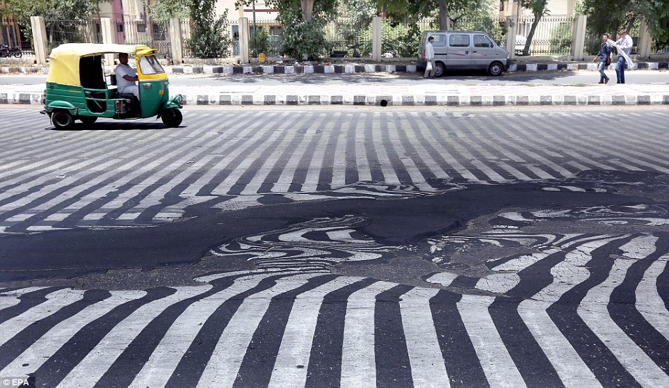 Searing temperatures of up to 45 degrees Celcius have seen road surfaces start to melt in New Delhi, distorting the road markings