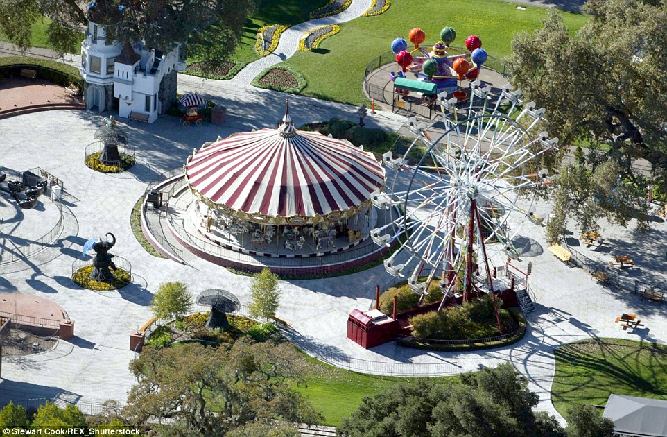 Long gone: Realtor Suzanne Perkins said that the amusement park (pictured 2003) the late King Of Pop constructed and his beloved exotic animals have been removed
