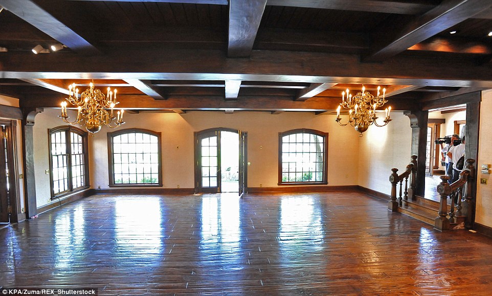 Lavish: A great room in the main house (pictured 2009) is decked out with exquisite gold chandeliers and giant windows, allowing in plenty of sunlight 