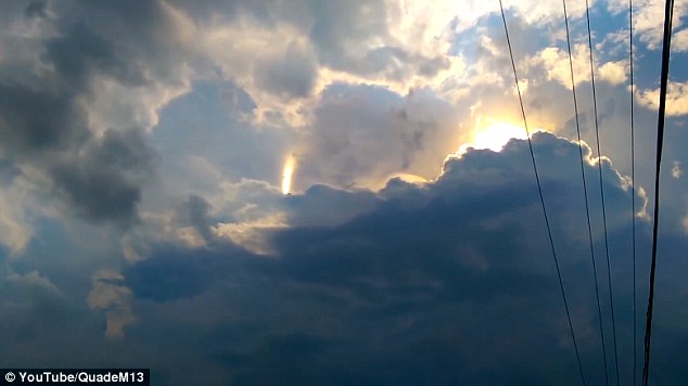 The video of jumping sundogs was filmed above Greenwood, Indiana. It shows a beam of light flickering among some clouds and moving. The effect is due to electric fields changing in the sundog. This occurs when light from the sun reflects in a certain way. The beam of light can be seen here in the middle