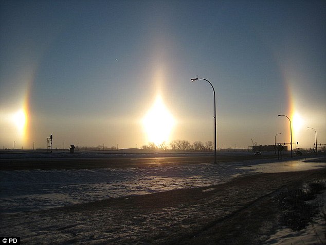 Sundogs are created when sunlight is refracted by large, hexagonal ice crystals, such as those in snowflakes. Shown is one over Fargo, North Dakota. They typically appear as two coloured patches of light either side of the sun and though rare, can in theory be seen anywhere in the world in any season