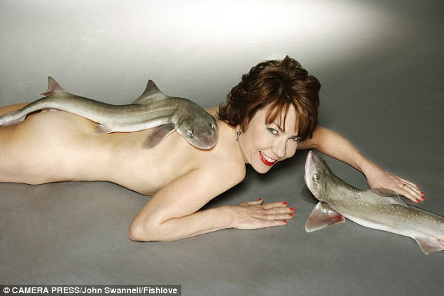 For her photo, writer and author Kathy Lette lies naked on the floor draped in dogfish