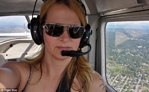 Flying high: Tiger  flying a plane in Canada before she left for Syria. She must now decide whether to return