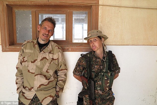 Friends: Tiger pictured with  Heval Berxodan, who's known to fellow fighters as the Dutch falcon of Rojava