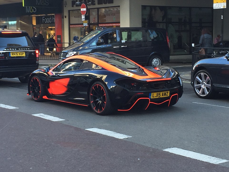 This souped-up orange and black McClaren P1, with a British-registered numberplate, joined the throng of supercars parading around the London streets. The car, which costs around £850,000, has a top speed of 217 mph and can go 0-60 in less than three seconds