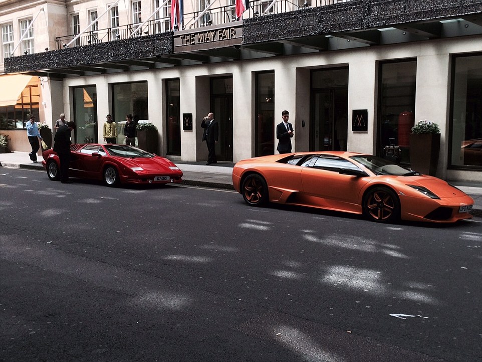 The streets of London are packed with sports cars, including this outrageous Lamborghini Countach (left) - the original 'poster car' of the Seventies and Eighties - and this Lamborghini Gallardo (right), both parked outside The Mayfair hotel in London 