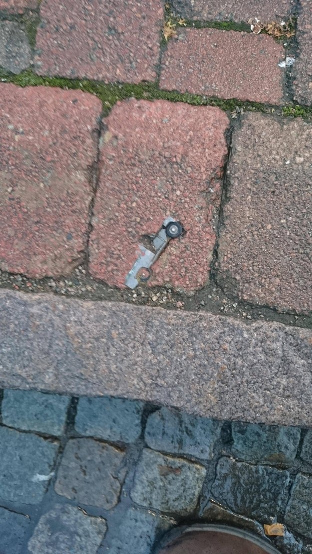A brick that somehow also contains a toy car.
