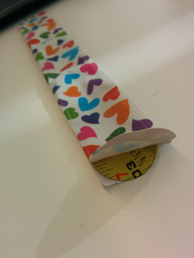 The measuring tape used to make a snap bracelet.