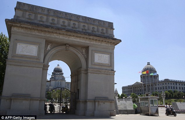 A college in Wuhan has decided to use its own version of the Arc de Triomphe, above, as its entrance gate