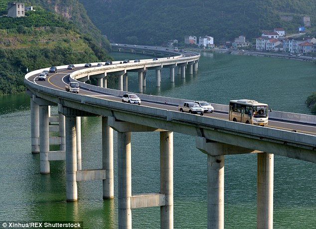 Incredible images of the new road shows that drivers are literally travelling over water as it is built on a bridge