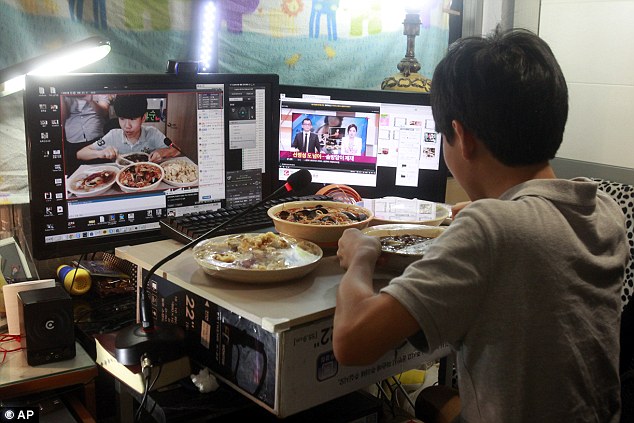 Kim eats pizza, fried chicken or Chinese food in a small room in his family's home and chats to viewers online