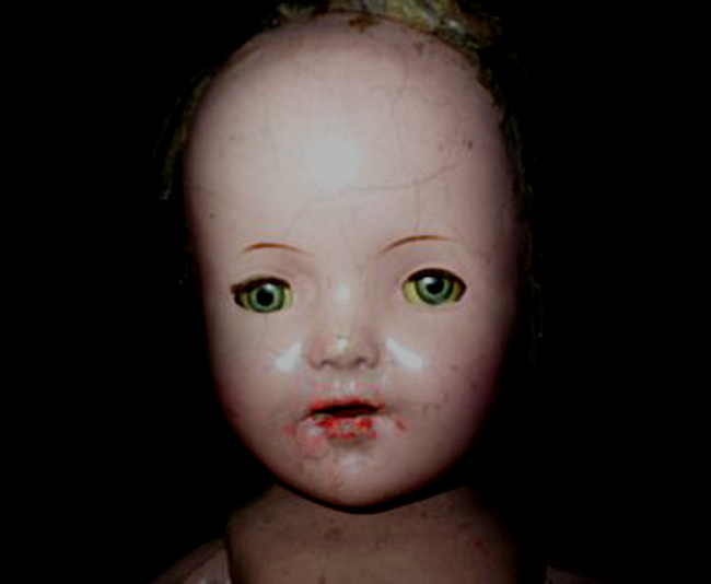 This beauty's name is Joliet. For four generations this doll has been passed down to the females of the family who each gave birth to two children, a boy and a girl, but mysteriously in all four cases the boy has died on the third day after his birth. The family claims the doll holds the spirits of the sons who died, which I guess would explain why they haven't destroyed it by fire yet.