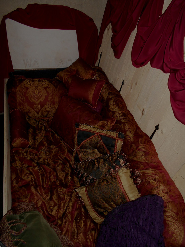 Wallace's original name plaque is still visible, and the coffin bed is placed atop the original slab that once contained his bones. But don't worry, he's been moved.