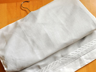 Turn old pillowcases into garment bags to keep your off-season clothes looking fresh.