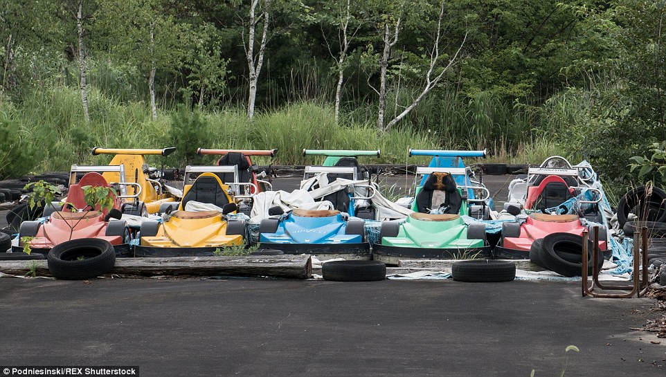 Go karts remain lined up and ready to race in an entertainment park located within the 12.5mile exclusion zone