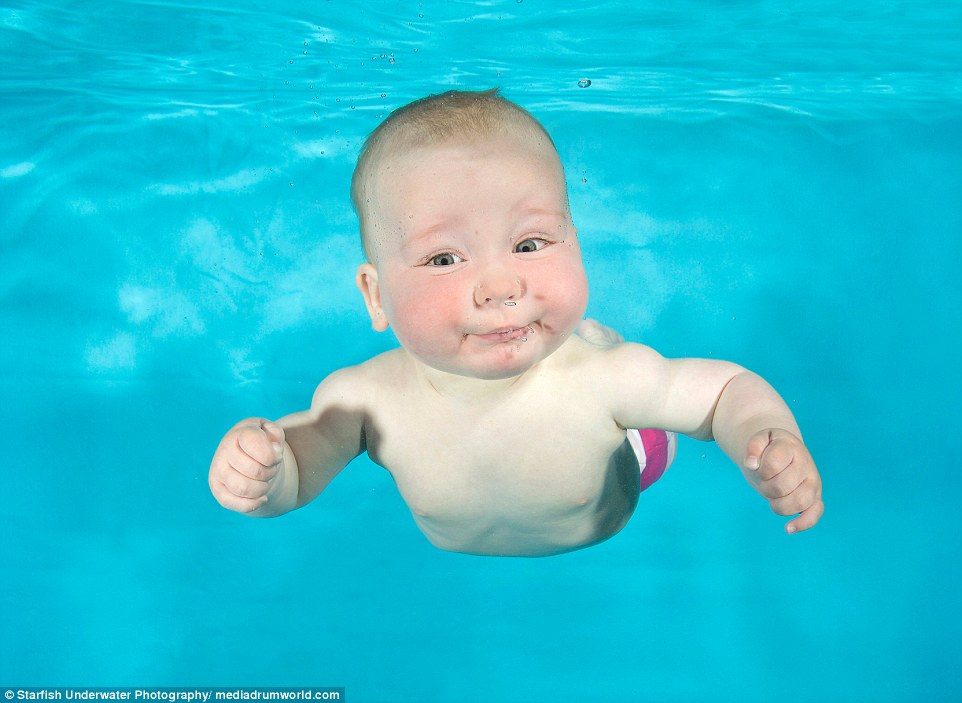 Lucy's photographs show the hilarious expressions on the faces of the little swimmers, including Fern, 8 months, at an underwater photoshoot with Aquatots Swim School in Gloucestershire