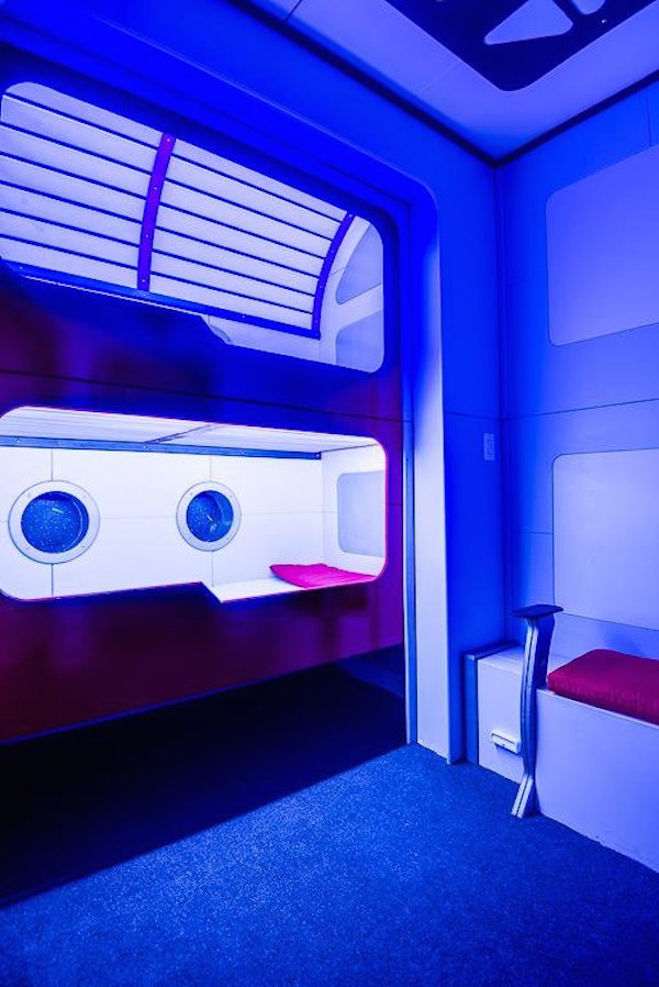 blue lighting brings the sci fi experience home especially in the pod style bunk beds A Texas home has a secret room that makes it unlike any place on the market (13 Photos)