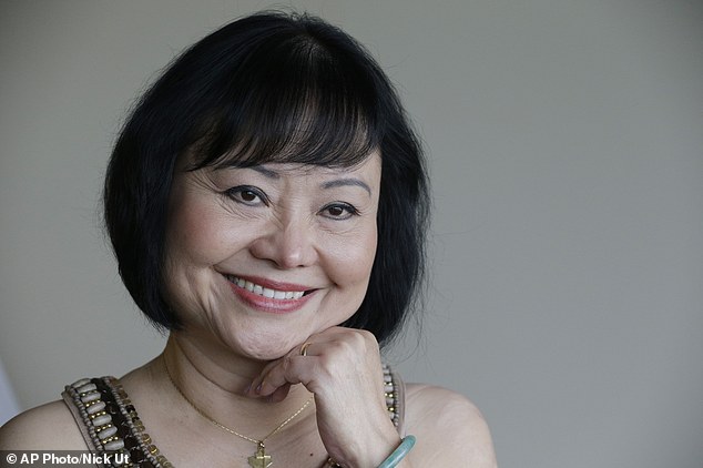 Kim Phuc poses for a photo at a hotel in Miami. Phuc arrived from her home in Canada to undergo a series of laser treatments to reduce the scars and pain she has endured for over 40 years.