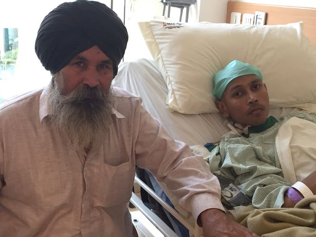 Gurmeet Singh pictured alongside his father at Max hospital on October 28, 2015 in New Delhi, India