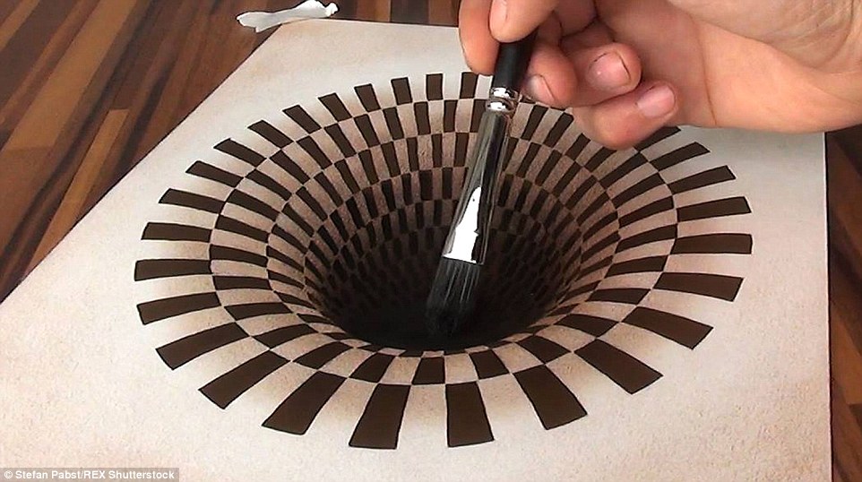 Optical illusion: This vortex looks as though it's a cavernous hole in the table but it's all part of the mind-bending illusions created by 3D artist Stefan Pabst from Germany