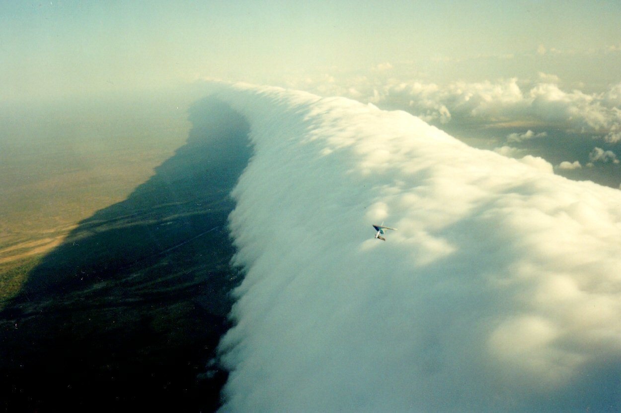 Hanging Glider Over Roll Cloud