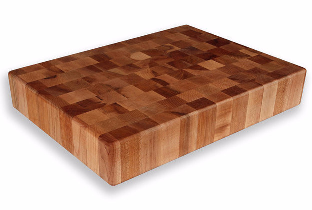 A solid butcher block cutting board.