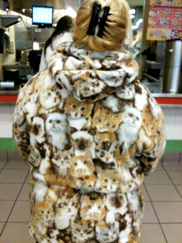 This woman wearing a cat coat.