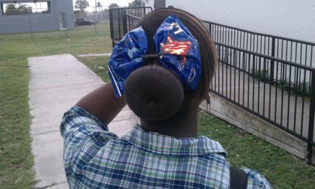 This girl wearing a Doritos bag in her hair.