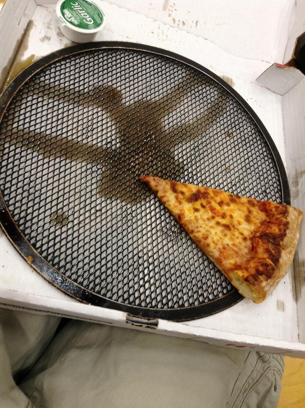 This time Papa John's left the cooking plate in the pizza.
