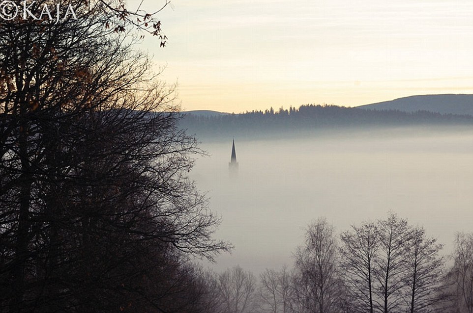 Kaja's version, which captures a church spire poking through the mist, was taken from a wider angle
