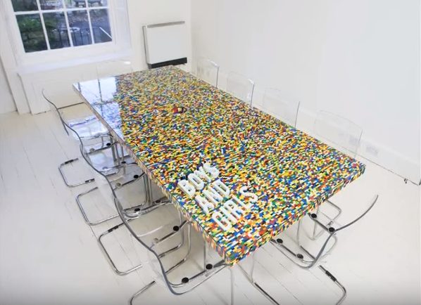 As a fun office bonding project, have everyone build a LEGO conference table!